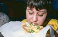 Photograph: [Woman Eating a Chalupa]
