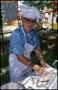 Photograph: [Dr. John M. Hales Making Bread]
