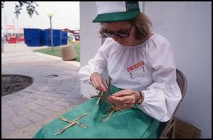Primary view of object titled '[Woman Making a St. Brigid's Cross]'.