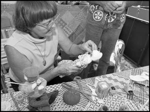 [Woman Making Apple Dolls]