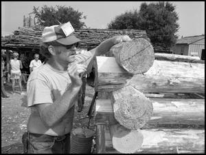 [Bill Mancham Constructing a Log Cabin]