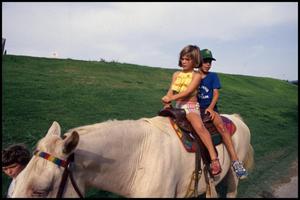 [Children Riding Horseback]