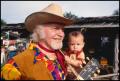 Photograph: [Red River Dave Holding a Baby]