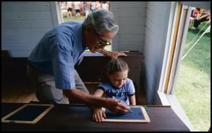 [Gerry Doyle Teaching Handwriting to a Young Girl]