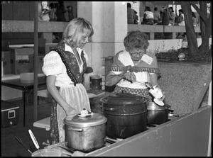 Primary view of object titled '[Two Women Cooking in Wendish Booth]'.