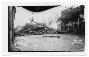 Primary view of object titled '[Chaparral Street north of drug store with storm debris]'.