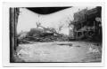 Photograph: [Chaparral Street north of drug store with storm debris]