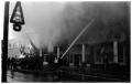 Photograph: [The Damron Hotel Fire, 13 of 21:  Christmas Decorations on Light Pol…