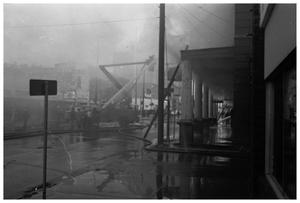 Primary view of object titled '[The Damron Hotel Fire, 11 of 21:   Fighting the Fire on W. Hubbard St.]'.