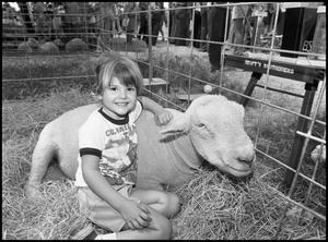 [Girl Sitting Next to Sheep]