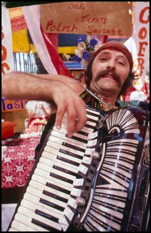 Primary view of object titled '[Accordionist at Polish Booth]'.