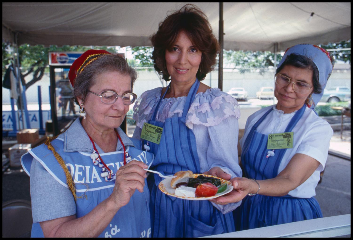 [Three Women with Plate of Food in Greek Booth]
                                                
                                                    [Sequence #]: 1 of 1
                                                
