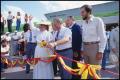 Photograph: [Bill Clayton Cutting Ribbon at Opening Ceremony]