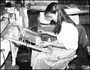 Primary view of object titled '[Pat Shelton Weaving on a Loom]'.