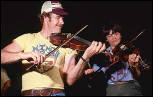 [Gene and Mary Nell Young Playing Violin]