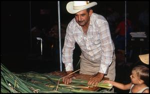 [Juan Martinez Demonstrating How to Thatch a Roof]
