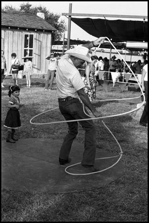 Primary view of object titled '[Bruce Montague Demonstrating Trick Roping]'.