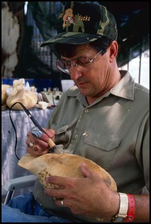 Primary view of [Bob Sitton Demonstrating Wood Carving]