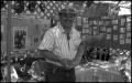 Photograph: [Dr. Eliseo Torres at Mexican Folk Medicine Booth]