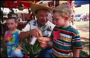 [Dr. Eliseo Torres at the Mexican Folk Medicine Booth]