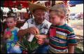 Photograph: [Dr. Eliseo Torres at the Mexican Folk Medicine Booth]