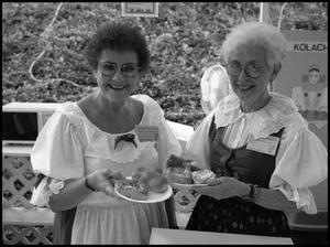 Primary view of object titled '[Mary Ann Kleffner and Irene Mazoch with Kolaches]'.