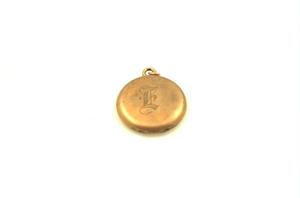 [Gold locket, engraved with "E"; belonged to Eugenia Wallace]