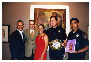 [Sylvia Orozco, Jorge Sedeño, and Police Officers at Taste of Mexico]