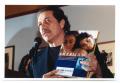 Primary view of [Edward James Olmos Holding a Book]