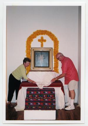 Primary view of object titled '[Couple Preparing Altar]'.