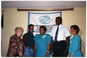 [Group in Front of Boys and Girls Clubs of America Banner]