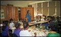 Photograph: [Woman in Blue and Students in Gates Elementary Classroom]
