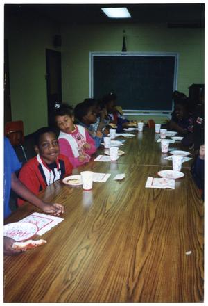 [Boys and Girls Club Eating Pizza at Lackland Air Force Base]