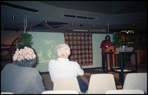 Primary view of object titled '[Man Speaking at Institute of Texan Cultures]'.