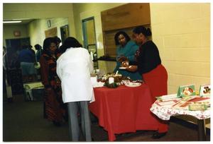[Joan Duncan and Links Members at Food Table During Christmas Party]
