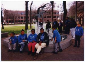 [Boys and Girls Club Children Sitting on Water Fountain]