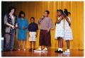 Photograph: [Links Members and Children on Stage]
