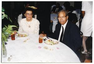 [Seated Man and Woman at Dorothy Washington Celebration]