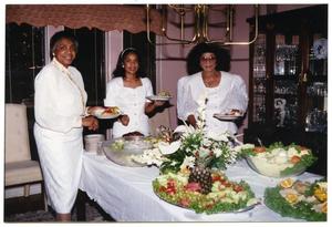 [Links Women Standing at Food Table During Dorothy Washington Celebration]