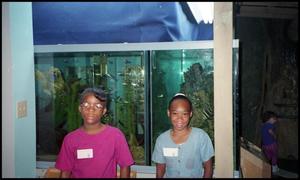 [Two Young Girls and Aquarium at Children's Museum]