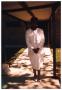 Primary view of [Standing Woman in White Formal Attire]