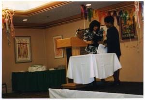[Two Woman in Exchange at Service to Youth Award Program]