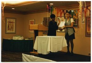 [Woman Presenting Award at Service to Youth Award Program]