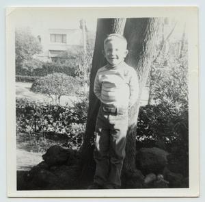Primary view of object titled '[Larry Tarver in Front of a Tree]'.