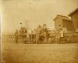Thumbnail image of item number 1 in: 'Railroad Survey Crew Members Sitting on a Flat Car, c. 1902'.
