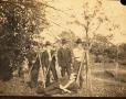 Thumbnail image of item number 1 in: 'Railroad Survey Crew Members Pose with Survey Instruments, c. 1902'.