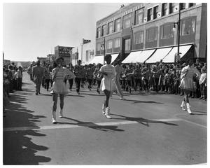 Primary view of object titled '[Anderson High School Majorettes Marching in Parade]'.