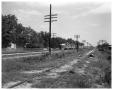 Photograph: Train, Railroad tracks and view of country