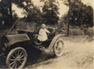 Charles P. Schulze, Jr., in car, c. 1914