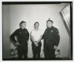 Thumbnail image of item number 1 in: '[Lee Harvey Oswald Standing With Officers]'.